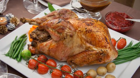 Roasted Stuffed Turkey with Gravy and Cranberry Sauce - Online Culinary ...